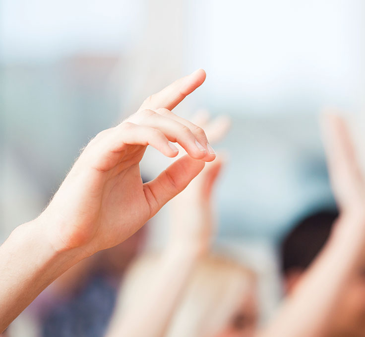 hand raised to ask question